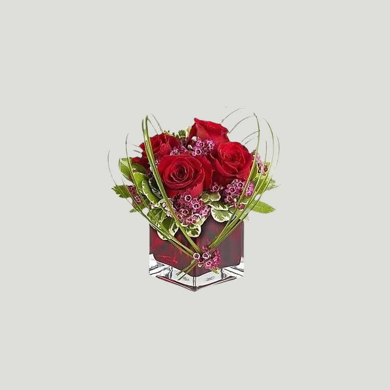 RED ROSES IN A VASE